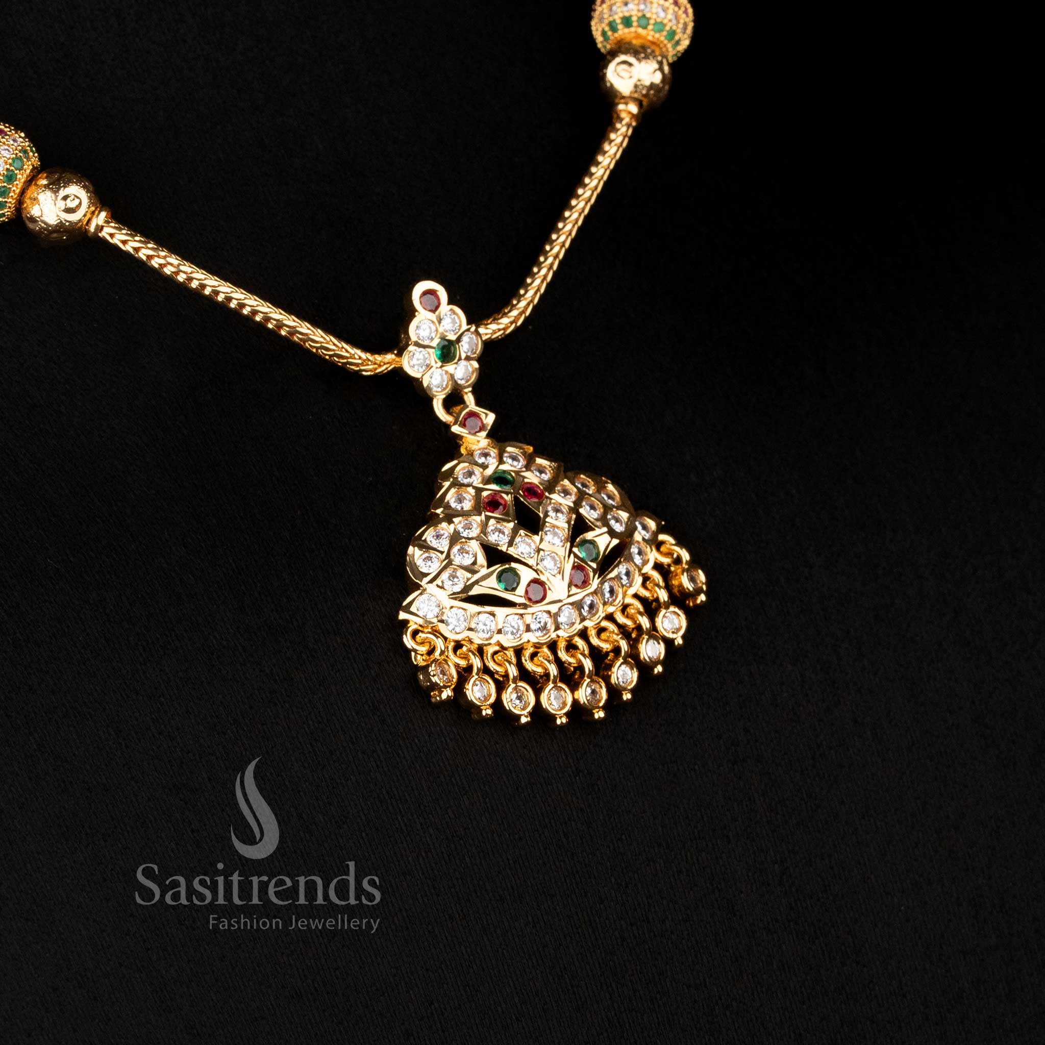 Temple style necklace featuring raised dome pendant and stone pattern structure