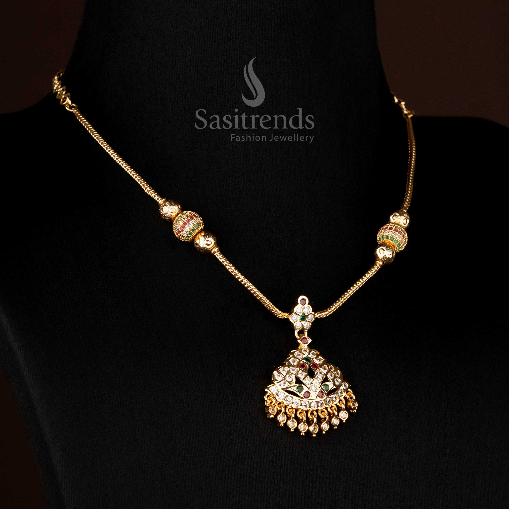 Temple style necklace featuring raised dome pendant and stone pattern structure