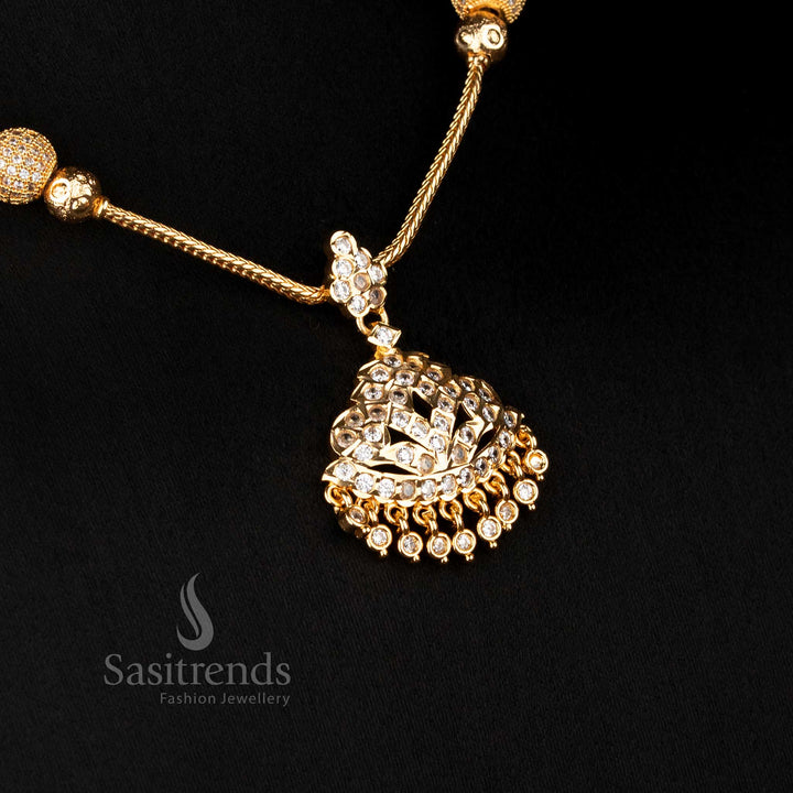 Temple style necklace featuring raised dome pendant and stone pattern structure