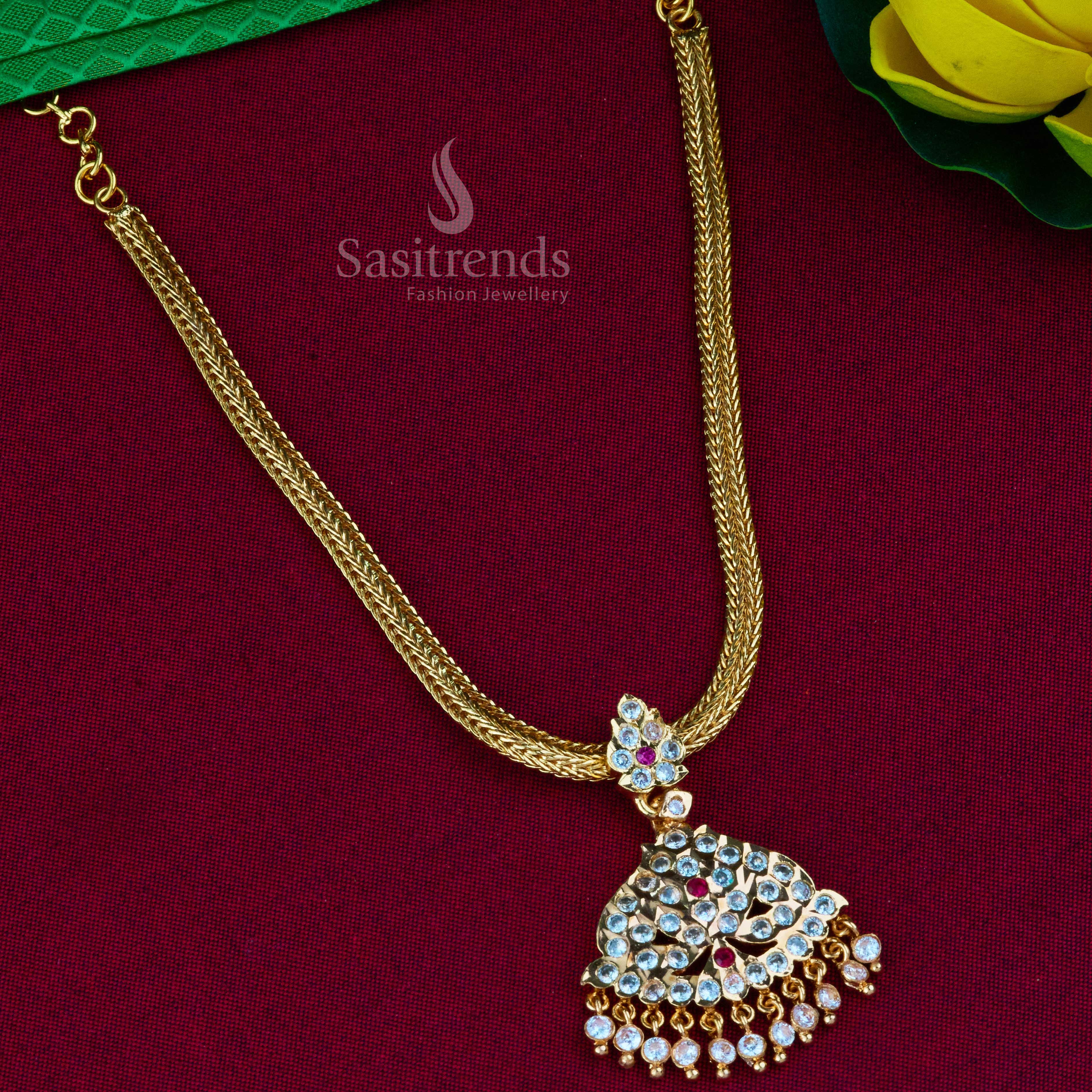Sophisticated traditional Attigai pendant necklace, showcasing an elegant design with micro gold plating and finely set AD stones, a timeless piece from Sasitrends
