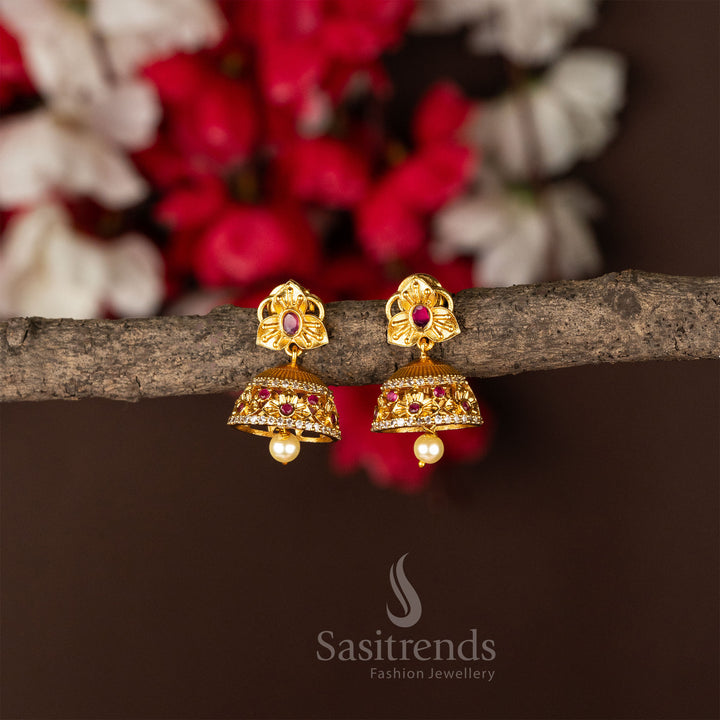 Temple matte gold plated white-ruby flower jhumka earrings designed with a classic touch and rich traditional jewellery vibes - Sasitrends
