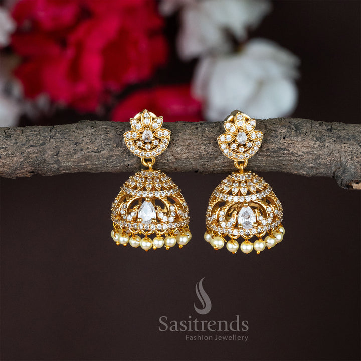Temple matte gold plated lotus flower jhumka earrings crafted with sparkling white stones and graceful traditional jewellery design - Sasitrends