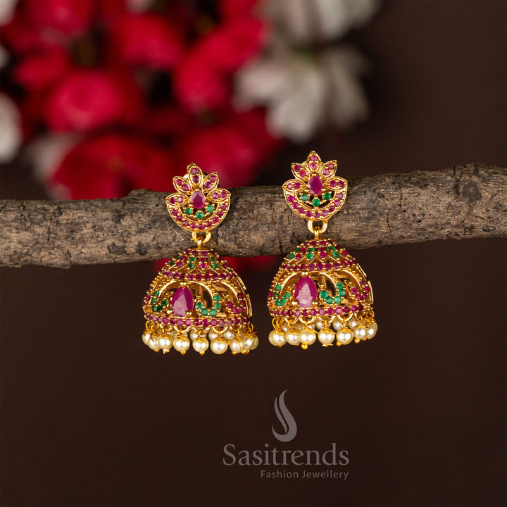 Temple gold plated lotus jhumka earrings in ruby-green stonework, reflecting elegant jewellery craftsmanship and classic temple styling - Sasitrends

