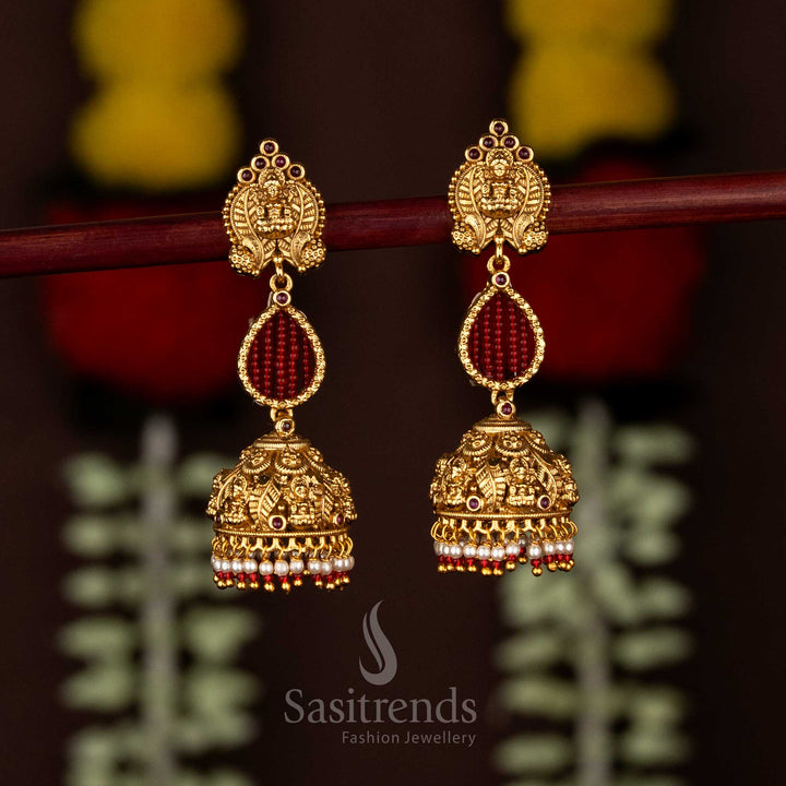 Traditional Divine Matte Gold Plated AD Lakshmi Motif Teardrop Stone Floral Jhumka Earrings with Pearl Drops