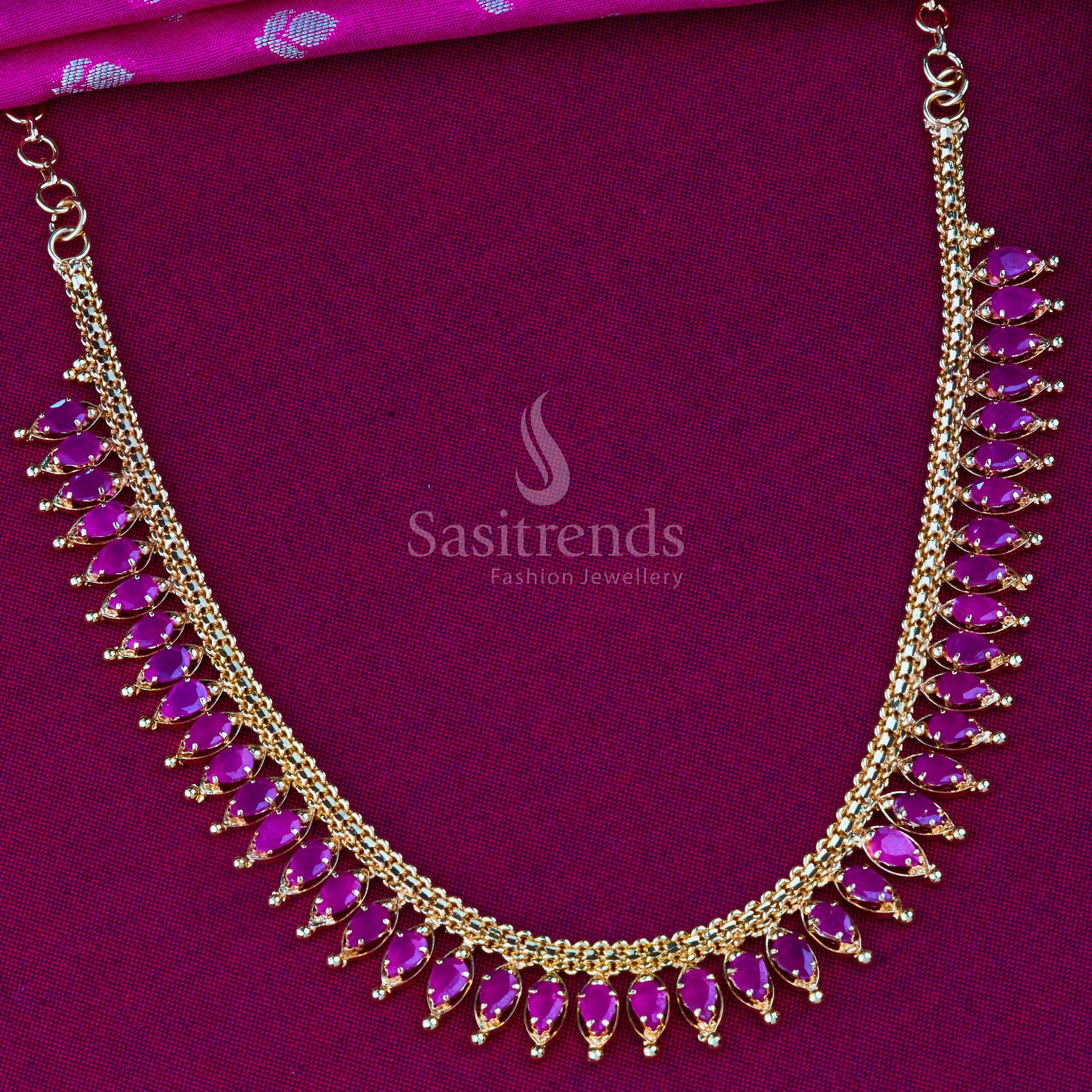Stunning ruby gold plated jewellery set with American diamonds, a perfect bridal collection piece with festive luxury appeal - Sasitrends