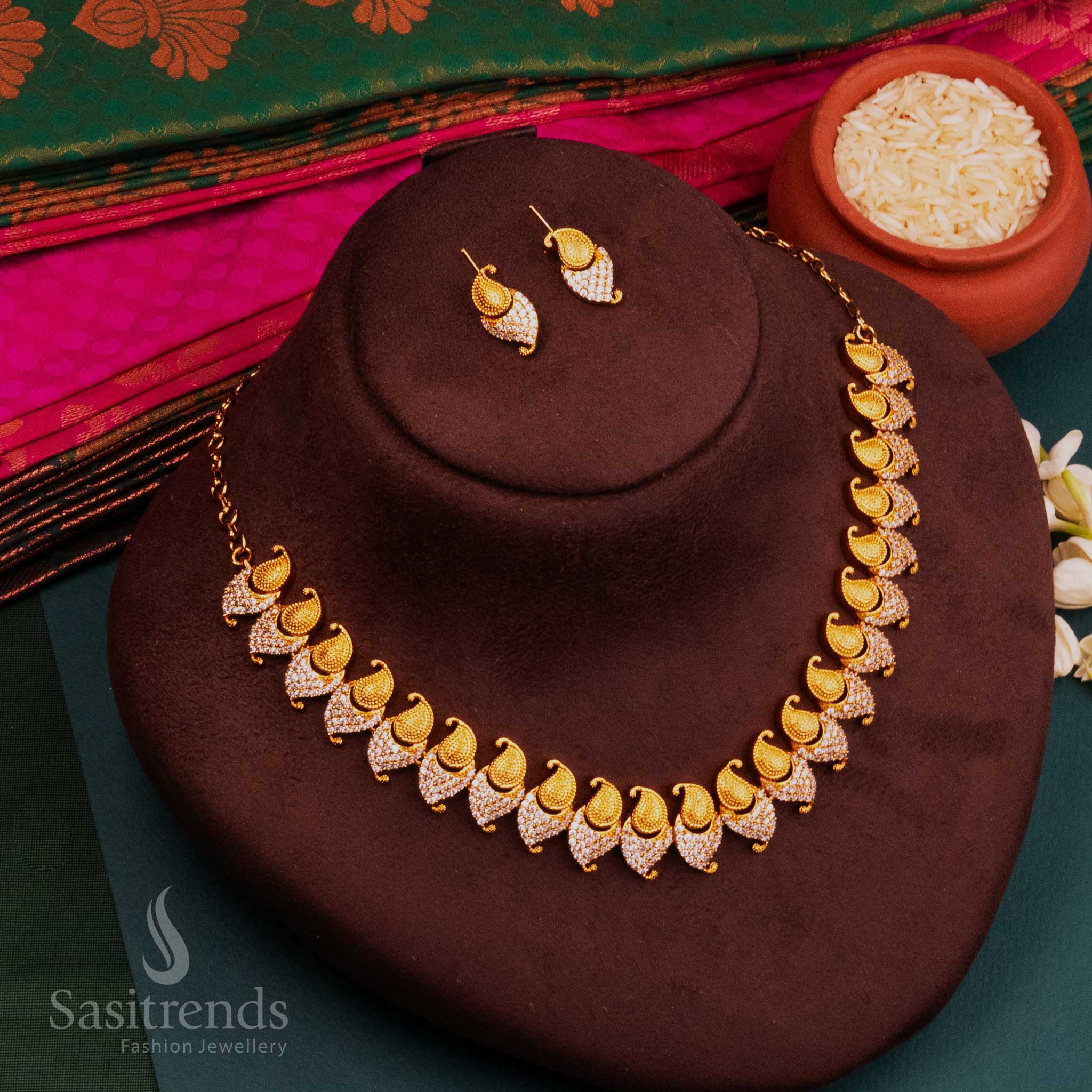 White AD accented temple jewellery set in glowing matte gold with spiritual elegance and radiant traditional vibes, crafted with sacred embellishments by Sasitrends