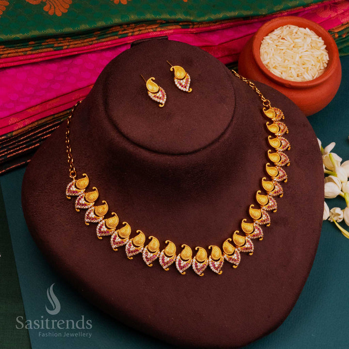 Temple inspired ruby-white AD studded matte gold jewellery set, blending ethnic elegance and goddess-inspired glow for a holy and luminous traditional ensemble by Sasitrends