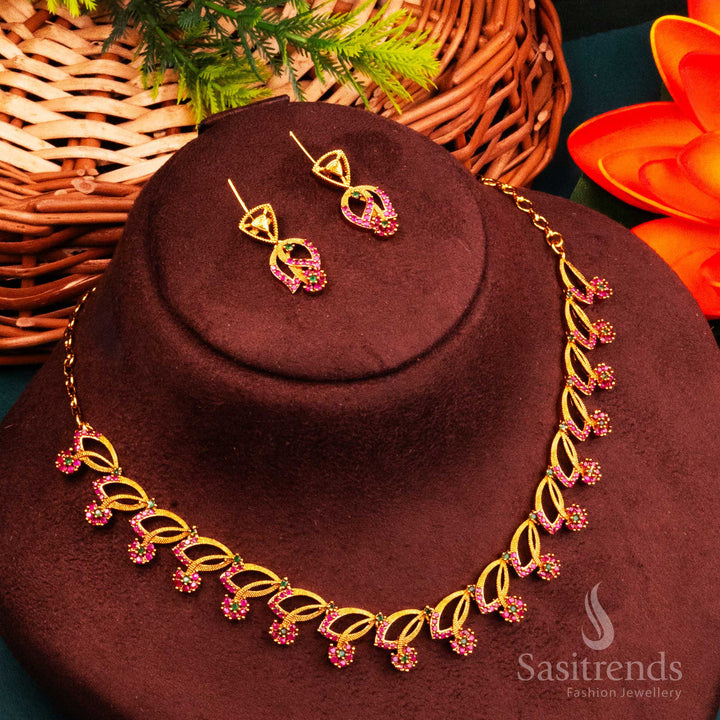 Floral Ruby Green Leaf Motif Temple Jewellery Set In Matte Gold With Sparkling AD Accents – Crafted With South Cultural Touch And Vibrant Spiritual Dual Stones – Sasitrends