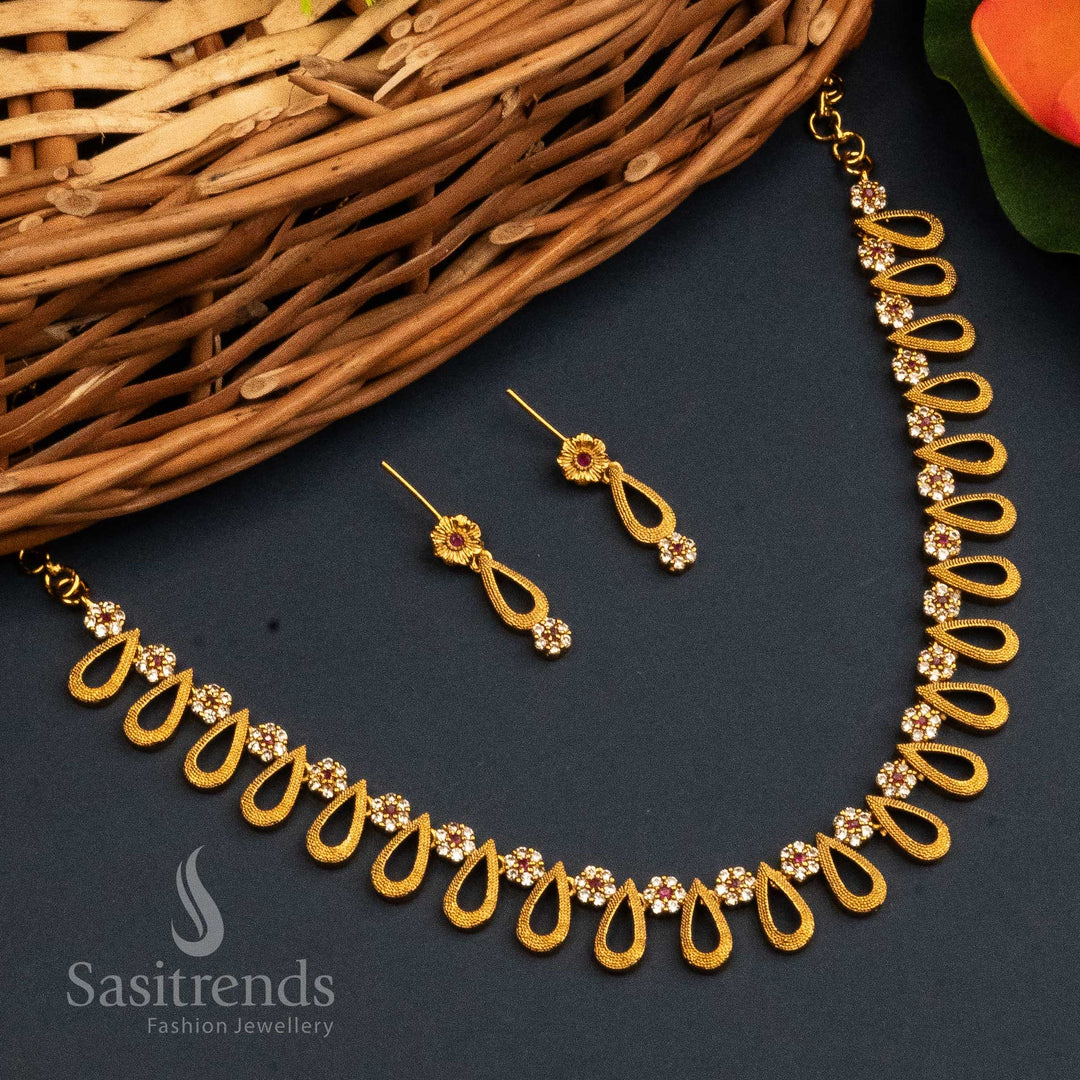 Dual Tone Ruby White Temple Jewellery Set With Matte Gold Finish, Sparkling AD Stones, And Luxurious Pendant With Traditional Earrings – Festive Finesse – Sasitrends