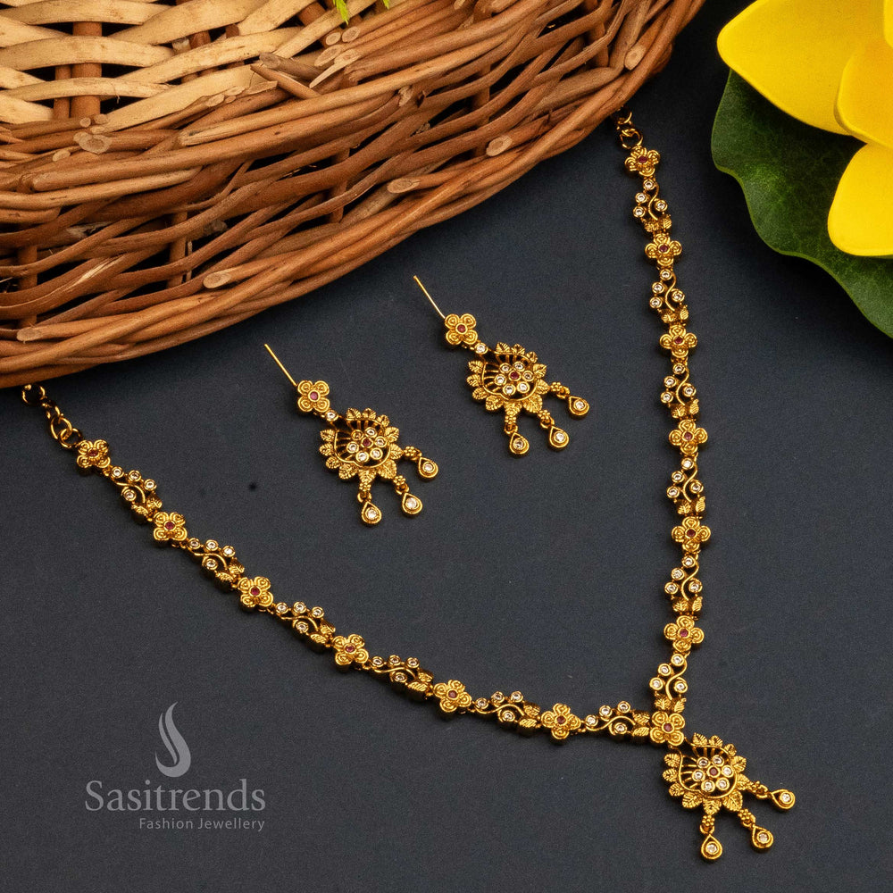 Dual Tone Ruby White Matte Gold Plated Temple Jewellery Set With Sparkling AD Stones, Decorative Floral Pendant And Traditional Jhumka Earrings – Festive Glamour – Sasitrends