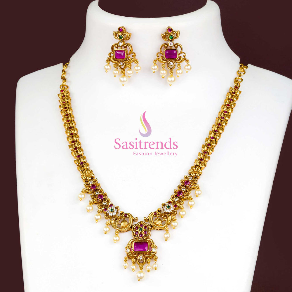 Vibrant Multicolour Temple Jewellery Set With Matte Gold Tone, Intricately Designed Pendant, AD Accents And Matching Pearl Drop Jhumka Earrings – Perfect For Festive Occasions – Sasitrends

