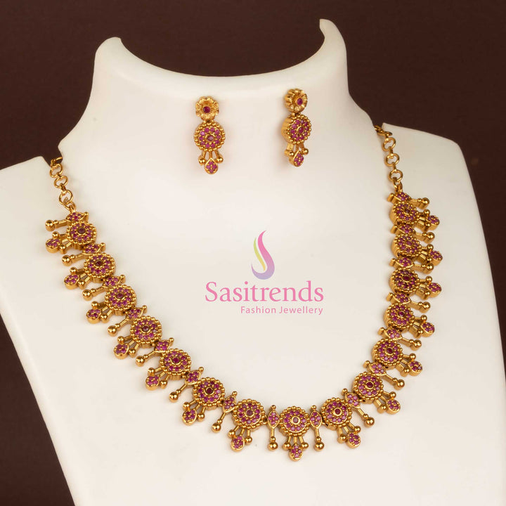 Gorgeous ruby temple matte gold plated necklace jewellery set embellished with shining AD stones, a graceful piece for girls to style in cultural and festive occasions - Sasitrends