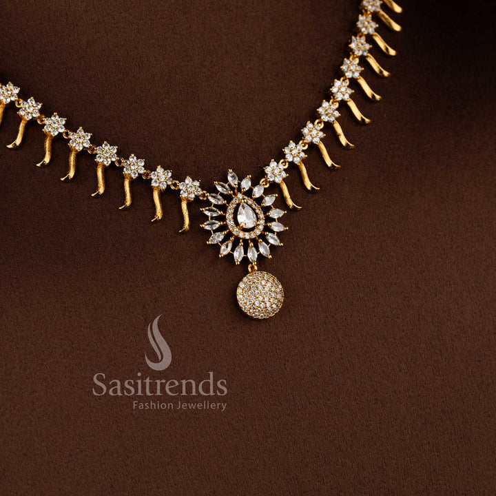 Elegant matte gold floral necklace set with white AD stones for party and festive wear.