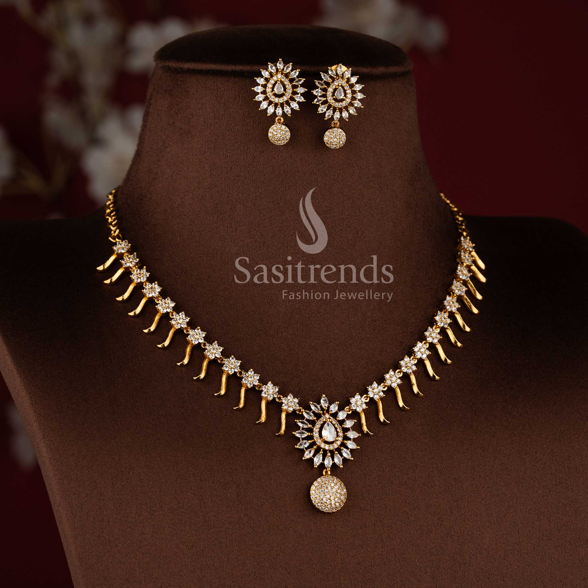 Gorgeous matte gold plated floral necklace jewellery set with white American diamond stones by Sasitrends.