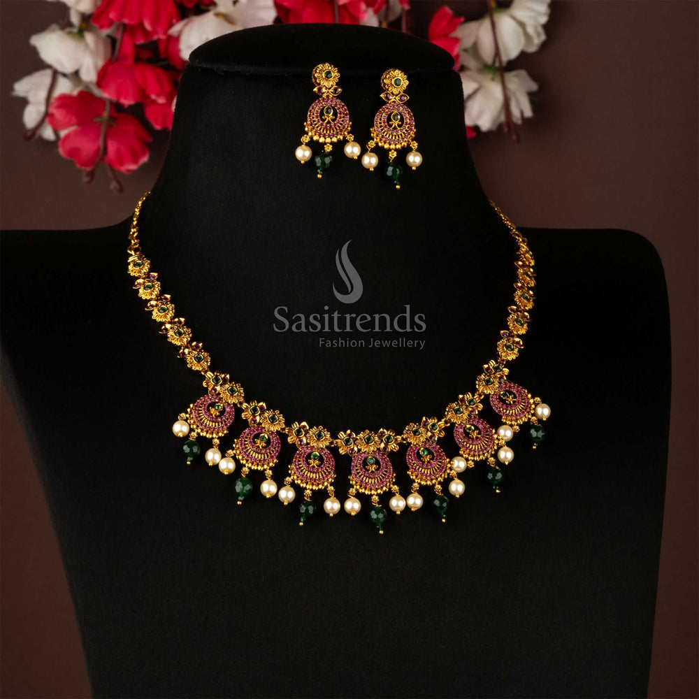 Ruby-green temple jewellery with pearls and AD crystals, finished in matte gold and glowing with South Indian ethnic sheen and festive ceremonial glamour by Sasitrends