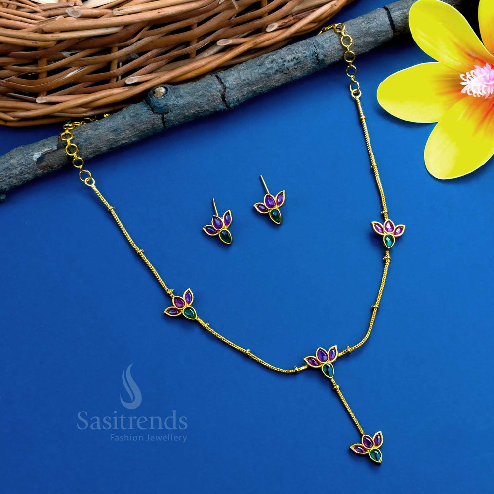 Artistic matte gold-plated temple necklace set with floral lotus motifs, designed with ruby and green stones - Sasitrends