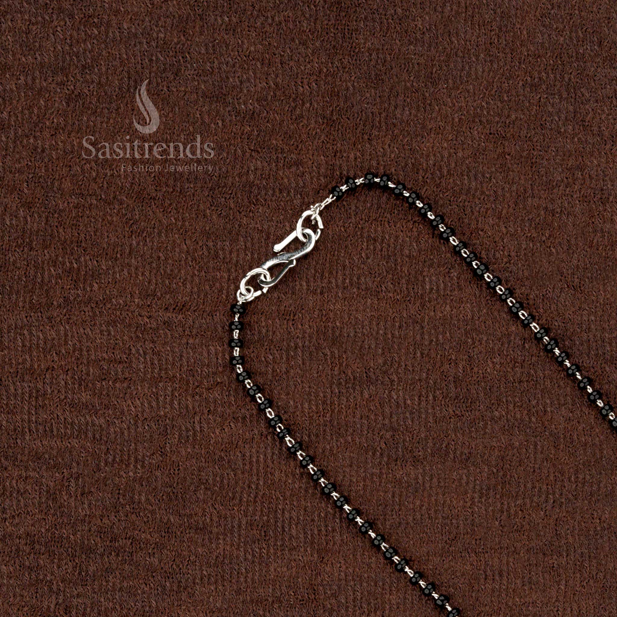 Elegant festive mangalsutra featuring a crescent-shaped AD pendant - Sasitrends