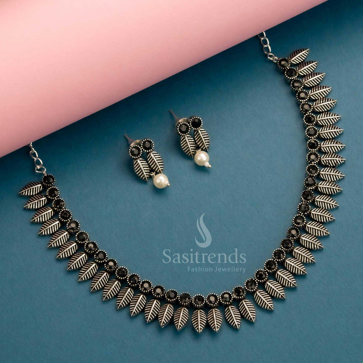 Fashion-forward oxidised jewellery set in black stones with leaf-inspired design and sleek earrings – Sasitrends