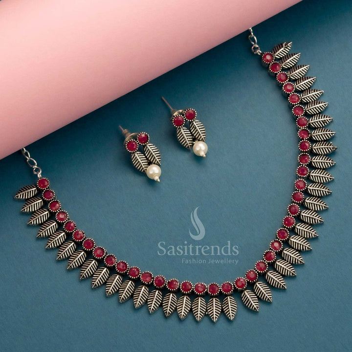 Stunning oxidised silver set with ruby stones and trendy leaf pattern design for festive styling – Sasitrends