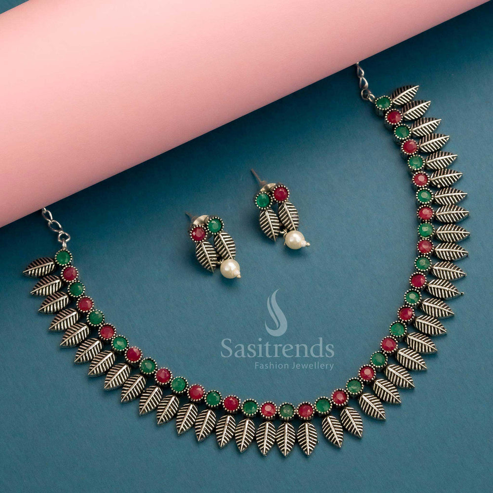 Dual-tone ruby and green oxidised necklace jewellery set with trendy leaf design and complementing earrings – Sasitrends