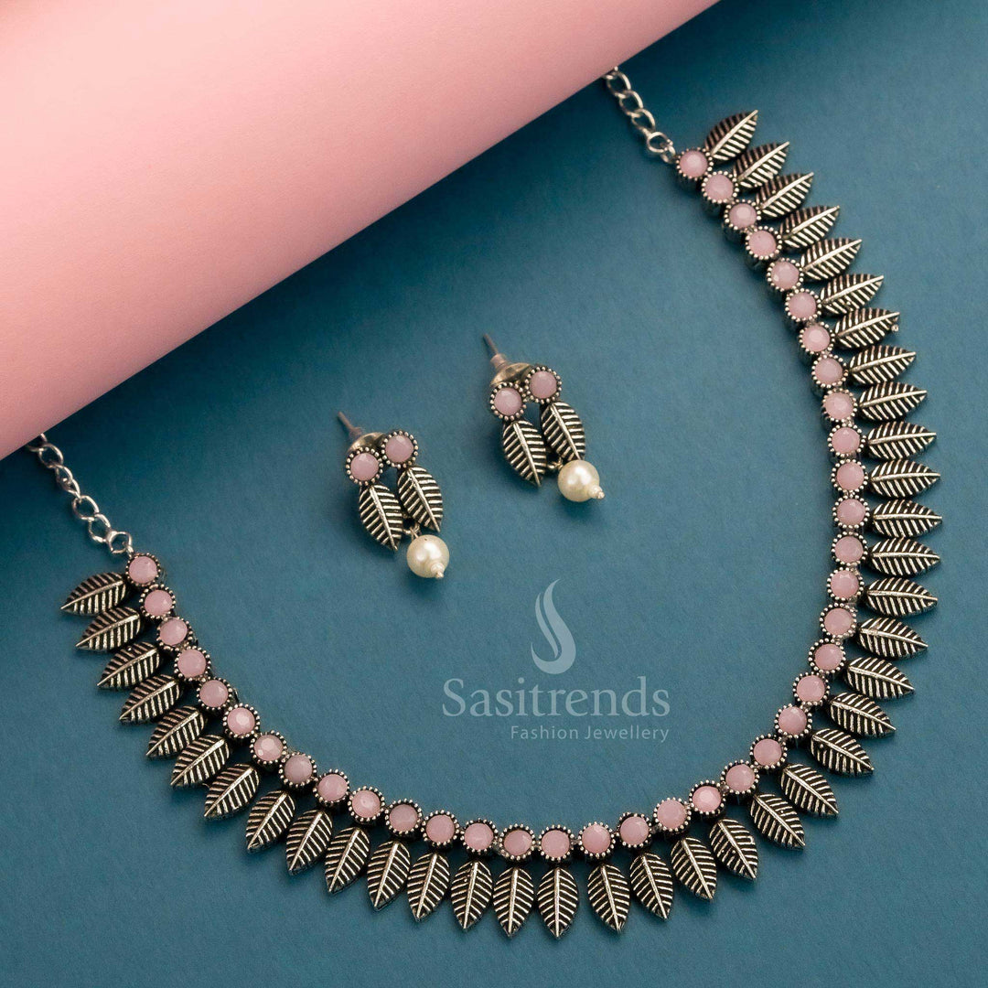 Delicate pink oxidised necklace with stylish leaf detail and matching earrings for a graceful ethnic look – Sasitrends
