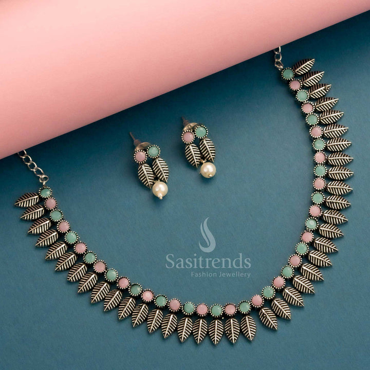 Oxidised silver set with pastel pink and mint stones in leaf motif design and elegant earrings – Sasitrends