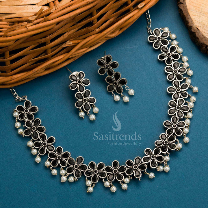 Black toned oxidised necklace set with floral stone pattern and pearl embellishments, includes earrings – Sasitrends
