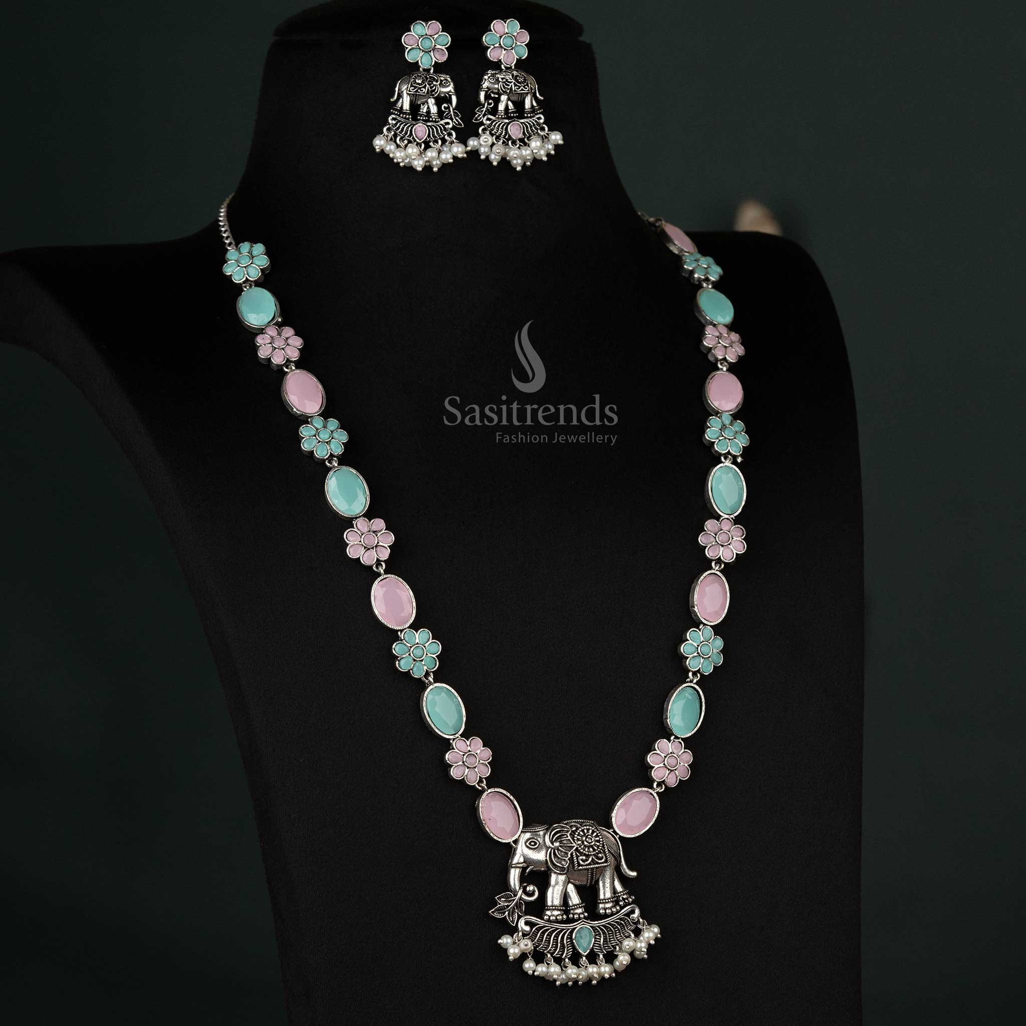 Charming oxidized necklace set with an elephant pendant and pearl drops in pink and mint, creating a whimsical and elegant look - Sasitrends
