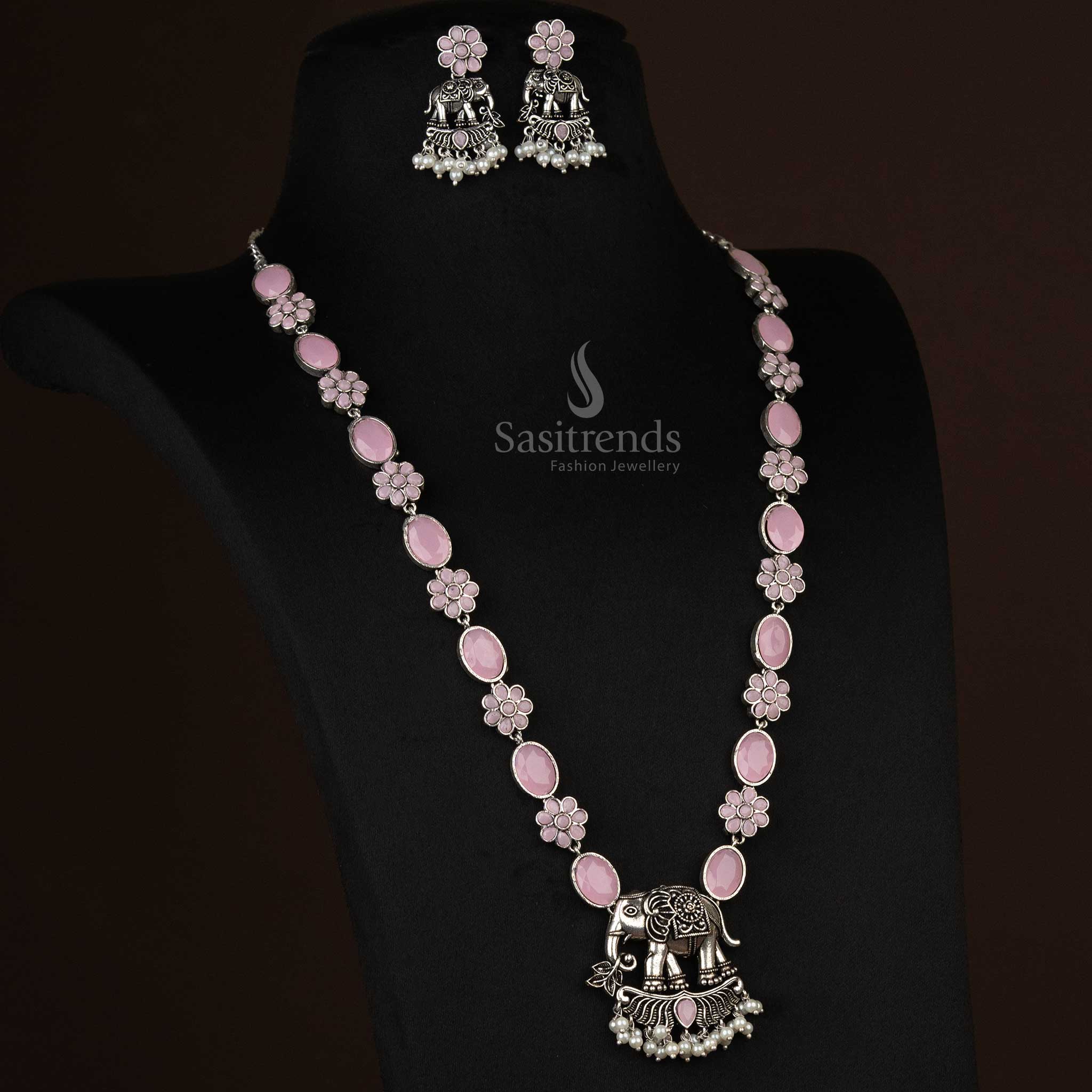 Delicate oxidized necklace featuring an elephant pendant and pearl drops in rosy pink, radiating grace and feminine elegance - Sasitrends
