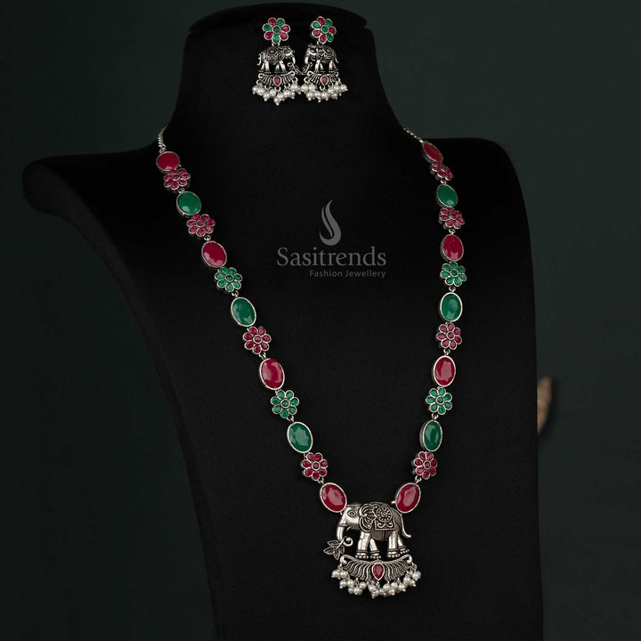 Vividly designed oxidized necklace with an elephant pendant and pearl drops in ruby and green tones, perfect for weddings and celebrations - Sasitrends
