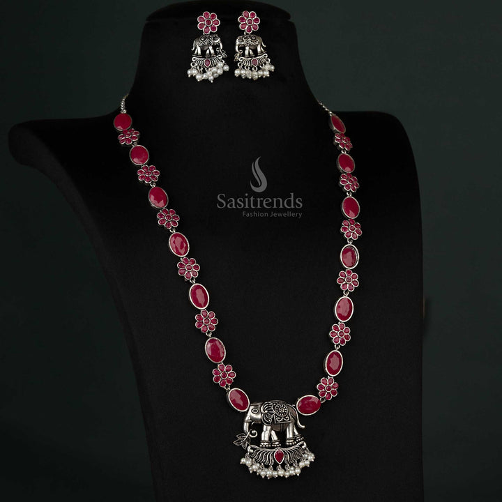 Intricate oxidized necklace set featuring an elephant pendant with pearl drops in rich ruby hues, ideal for festive and cultural events - Sasitrends