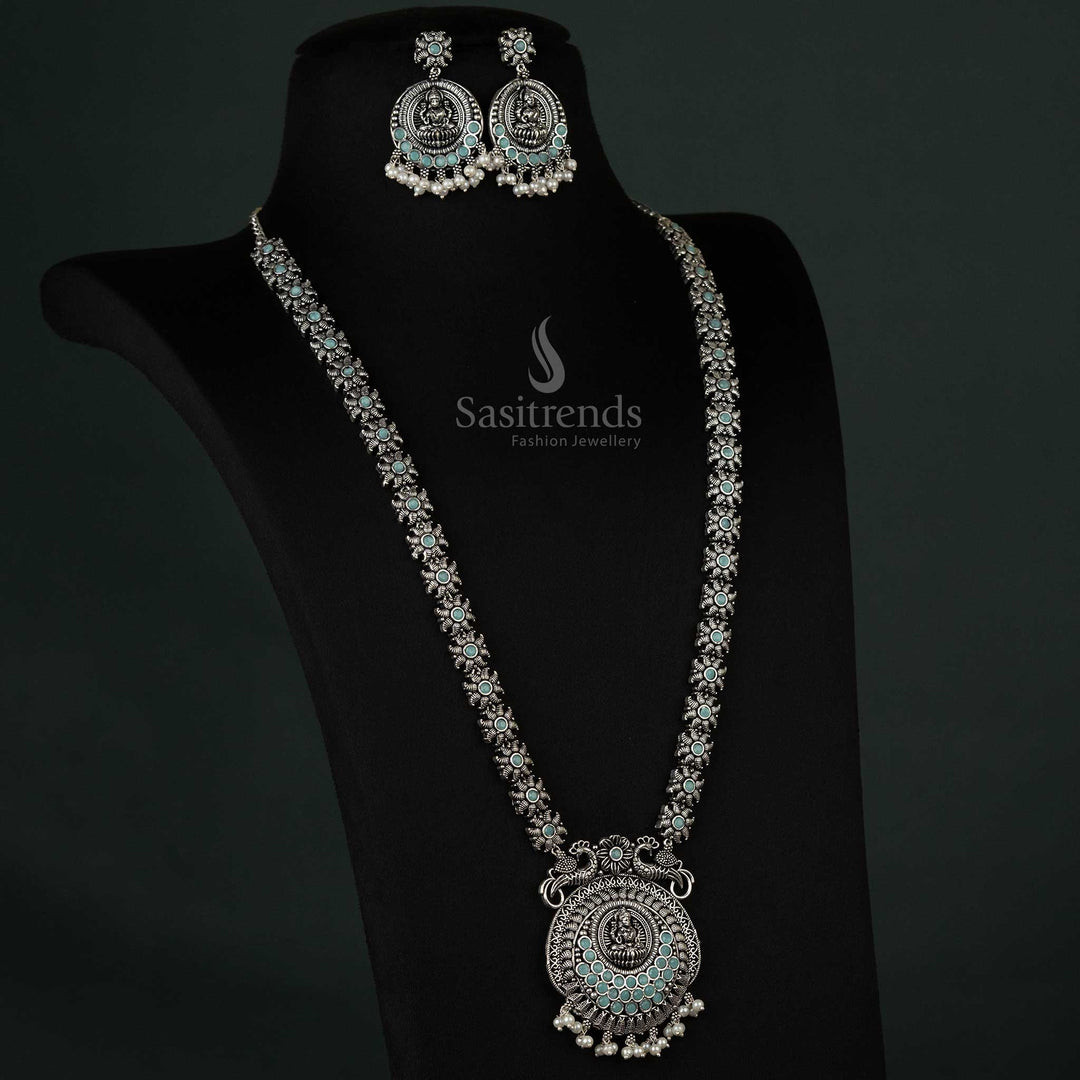 Delicate oxidized necklace featuring peacock and Lakshmi motifs with pearl drops in soft mint, adding a refreshing touch to any outfit - Sasitrends