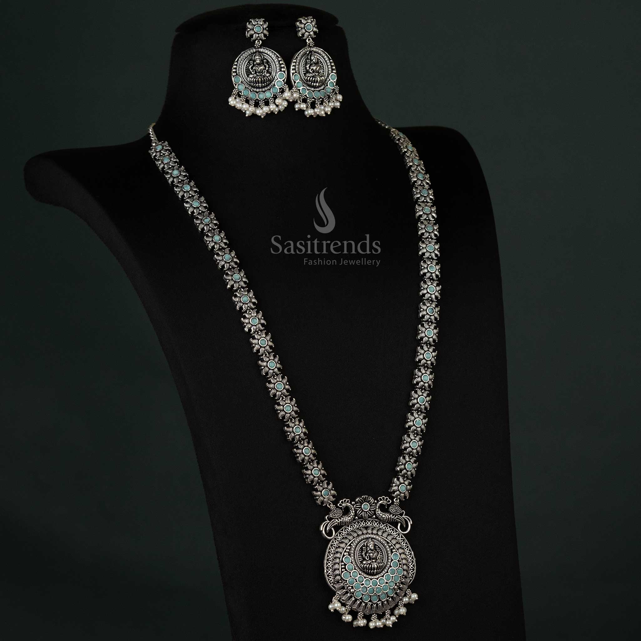Delicate oxidized necklace featuring peacock and Lakshmi motifs with pearl drops in soft mint, adding a refreshing touch to any outfit - Sasitrends