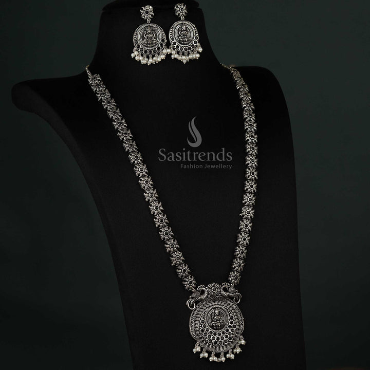Striking oxidized necklace featuring peacock and Lakshmi pendants with pearl drops in black, a versatile and elegant choice for any event  - Sasitrends