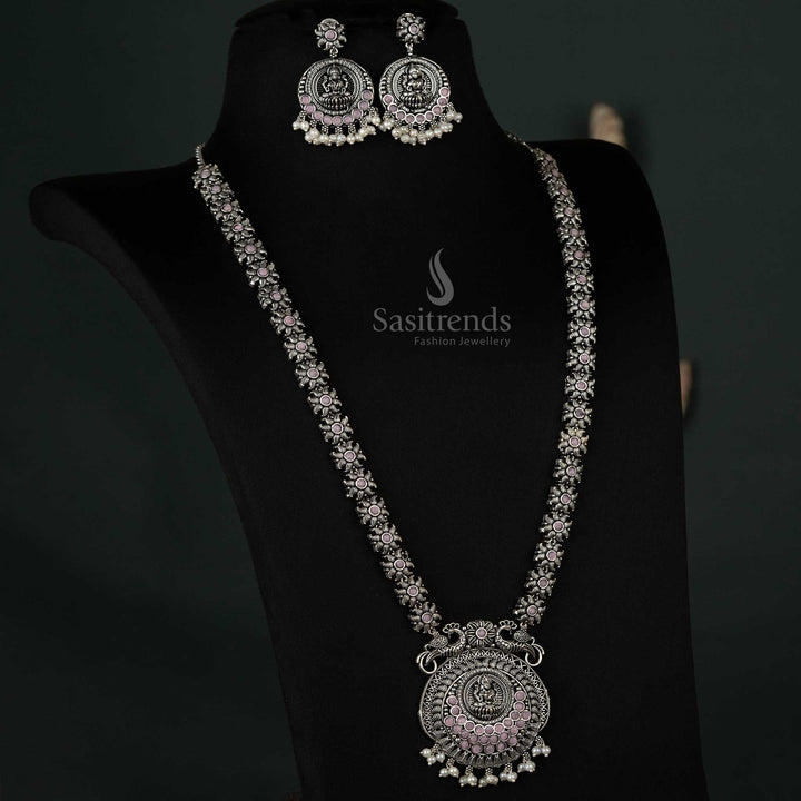 Elegant oxidized necklace with peacock and Lakshmi pendants and pearl drops in pink, offering a graceful and feminine ethnic look - Sasitrends