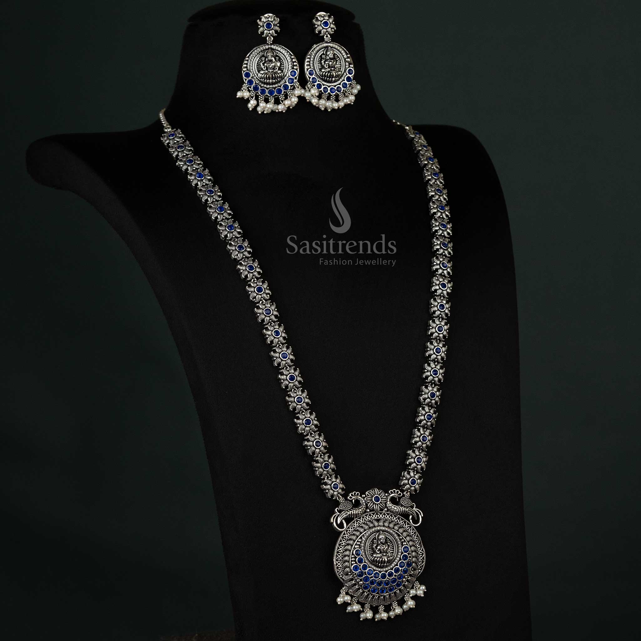 Stunning oxidized necklace with peacock and Lakshmi motifs and pearl drops in blue, exuding a regal and refined charm for grand occasions - Sasitrends