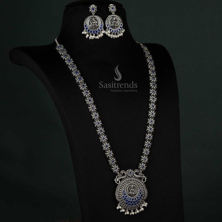 Stunning oxidized necklace with peacock and Lakshmi motifs and pearl drops in blue, exuding a regal and refined charm for grand occasions - Sasitrends