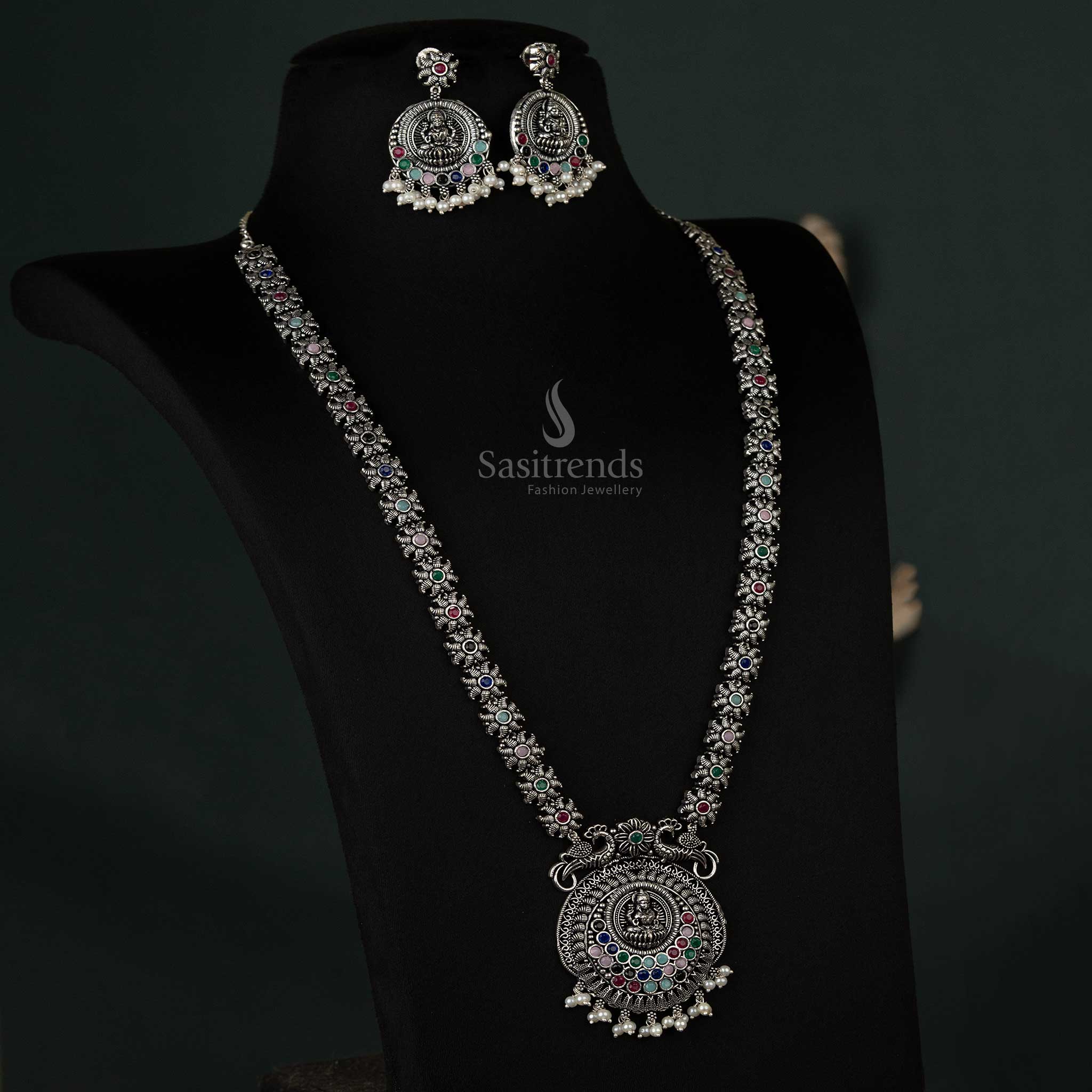 Eye-catching oxidized necklace with peacock and Lakshmi pendants and pearl drops in multicolor, a bold accessory for festive occasions - Sasitrends