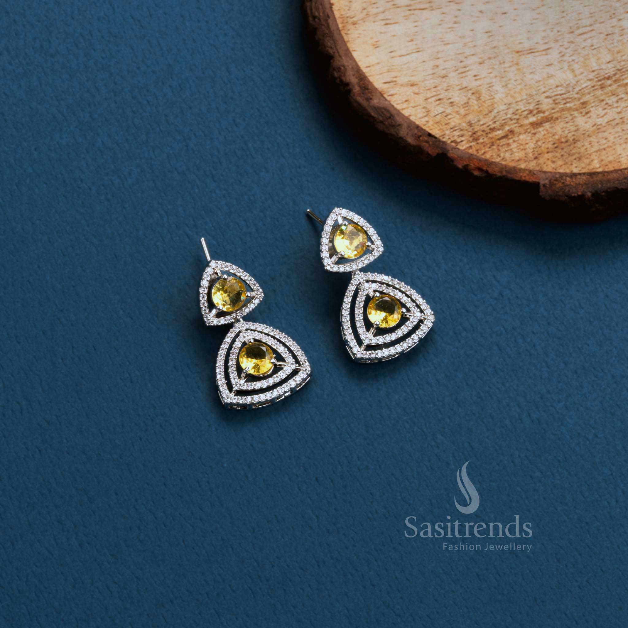 Golden Flick Vibe rhodium triangle earrings with LCD-yellow American Diamonds – modern party glow jewellery – Sasitrends