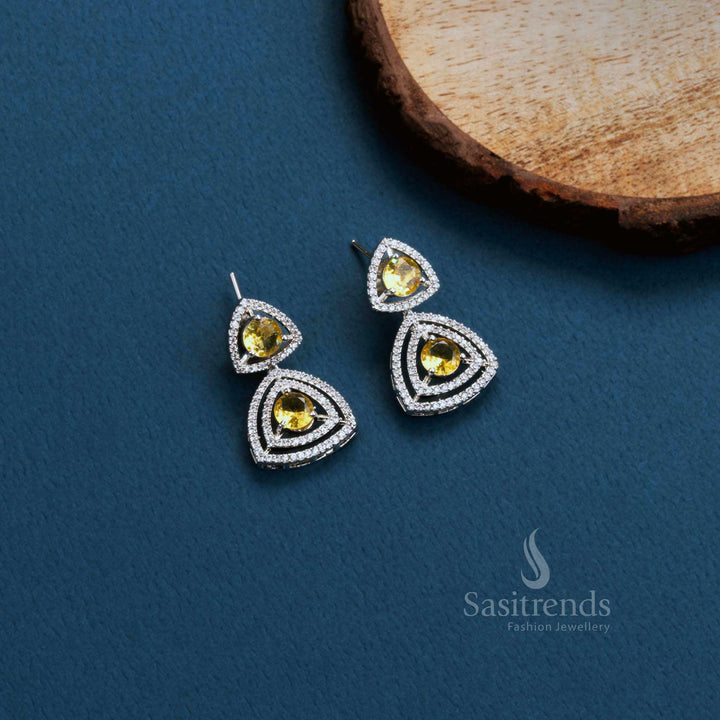 Golden Flick Vibe rhodium triangle earrings with LCD-yellow American Diamonds – modern party glow jewellery – Sasitrends