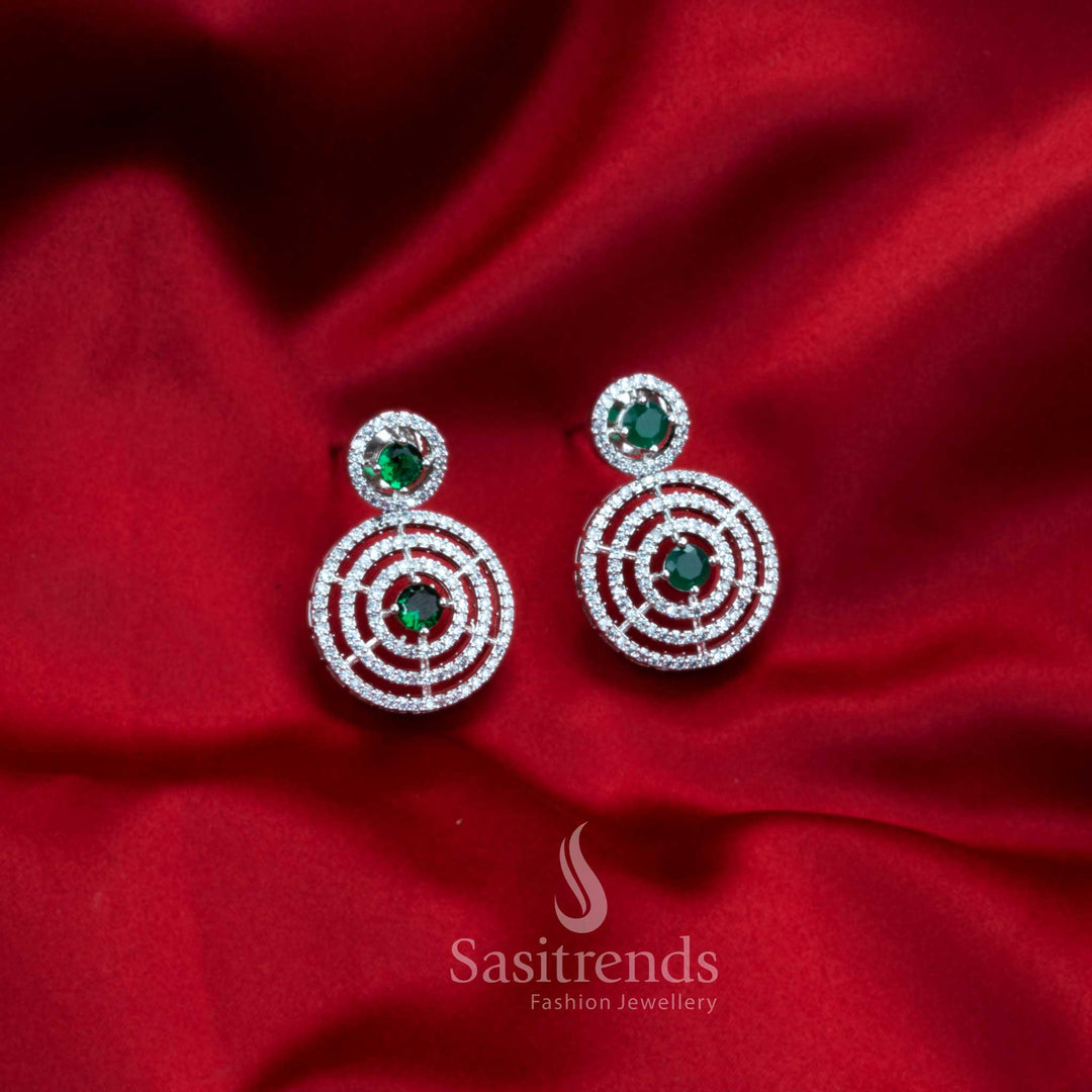 Emerald Circle Whisper rhodium earrings with vivid green AD stones – glamour-filled loop design party jewellery – Sasitrends