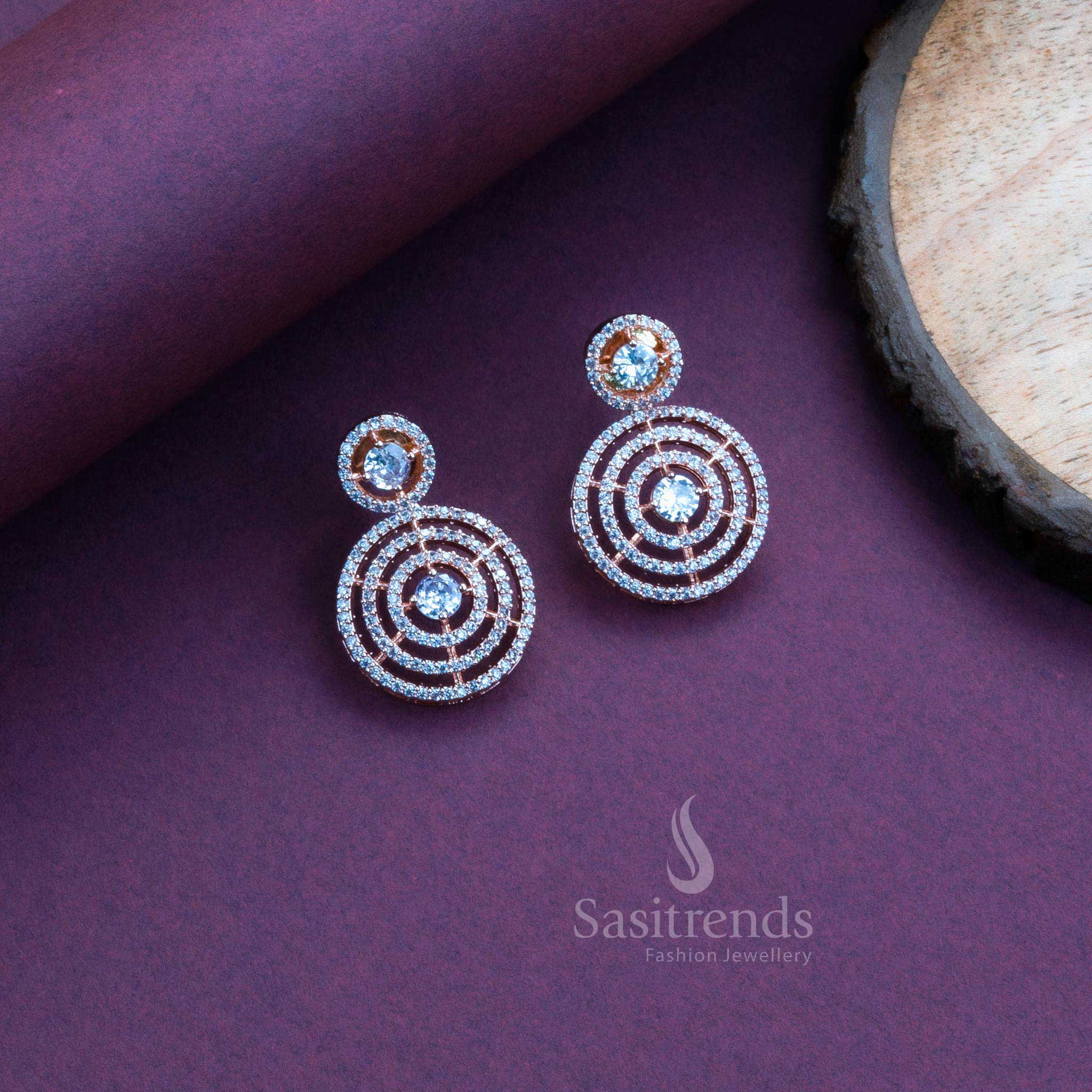 Glamorous white American diamond circle earrings in rose gold, perfect for party wear and elegant saree jewellery styling – Sasitrends