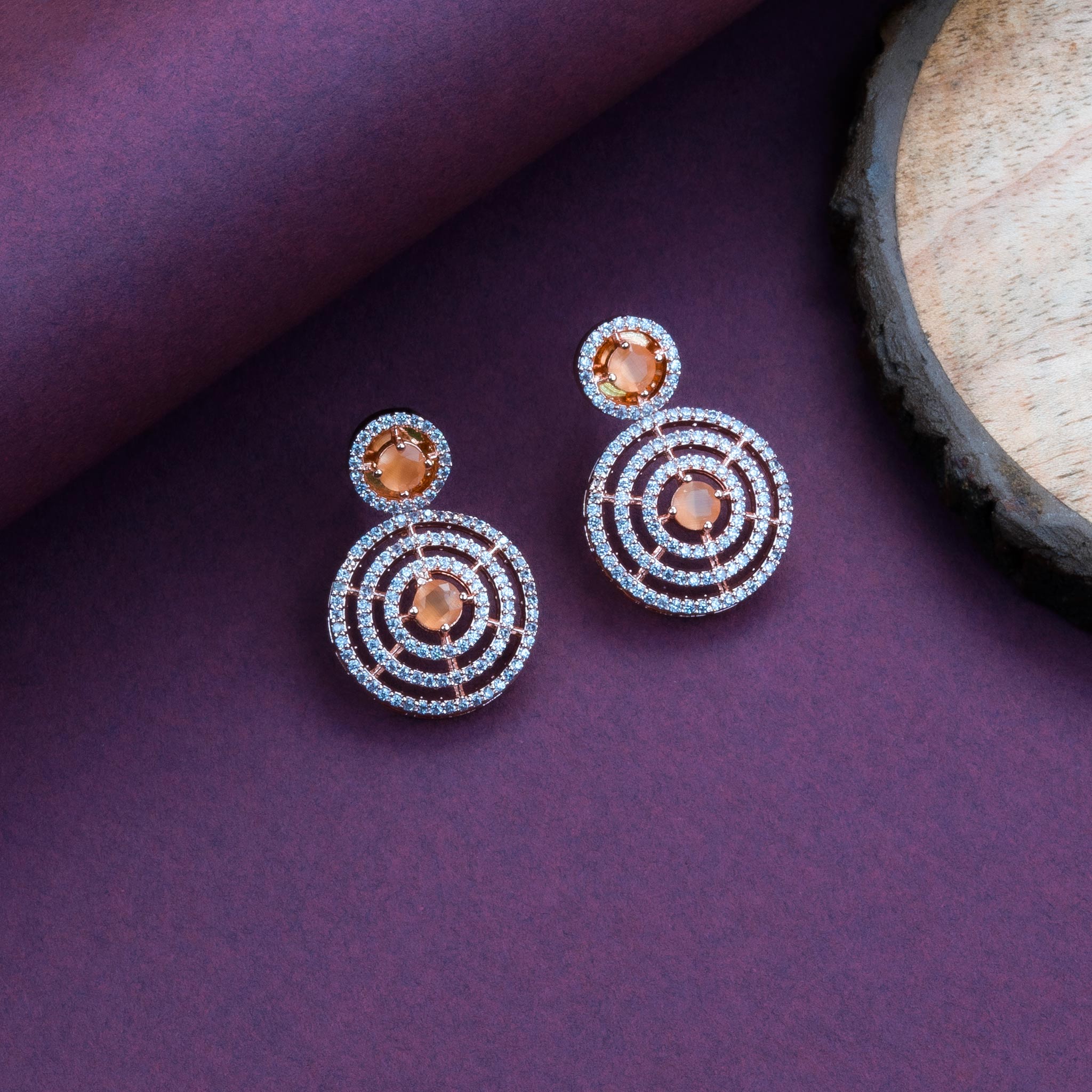 Elegant Orange gold plated earrings in a circle pattern, a stylish choice for festive jewellery collections – Sasitrends