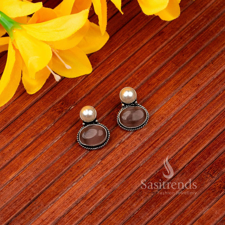 Graceful dark-pink oval Monalisa stone stud earrings in oxidised German silver – Jewellery For All Moods – Sasitrends