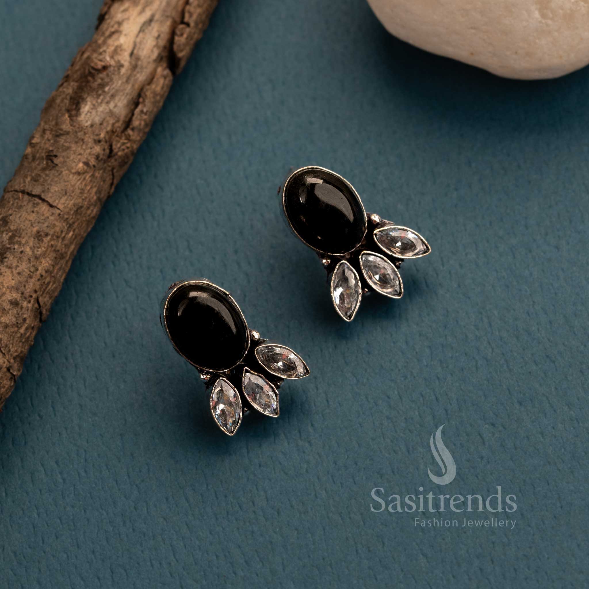 Bold black Monalisa stone and sparkling AD stud earrings in oxidised German silver – tribal-inspired traditional women’s jewellery with a dramatic flair – Sasitrends