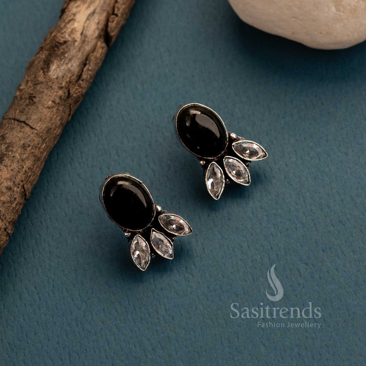 Bold black Monalisa stone and sparkling AD stud earrings in oxidised German silver – tribal-inspired traditional women’s jewellery with a dramatic flair – Sasitrends