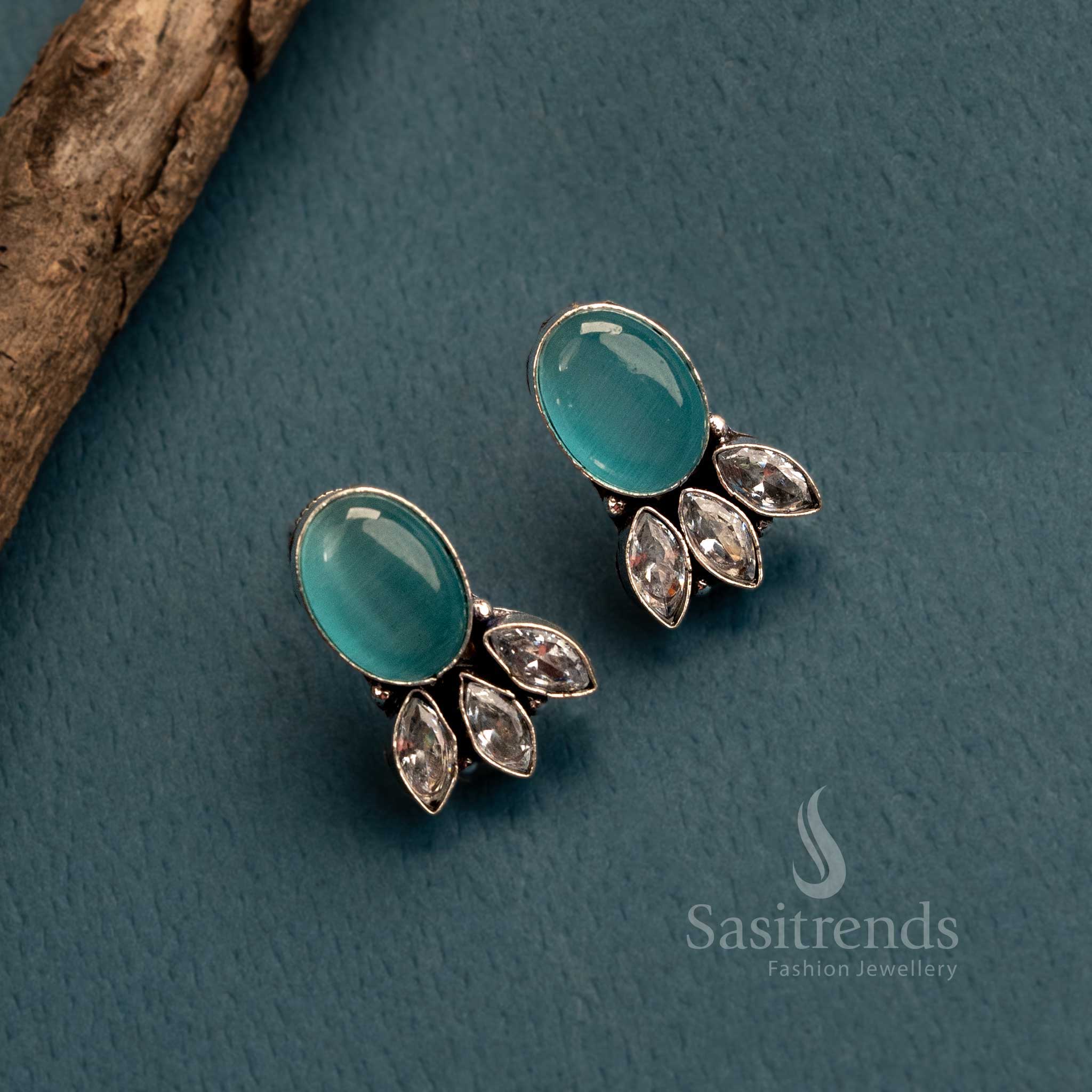 Trendy ocean blue earrings in oxidised German silver with Monalisa and AD stone styling – fashionable jewellery for elegant occasions – Sasitrends