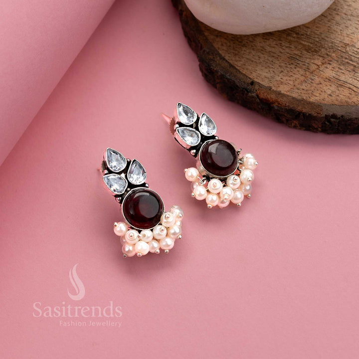 Elegant vinous oxidised German silver earrings with shimmering Monalisa stone, glittering AD accents and pearl hangings – vintage tone jewellery from Sasitrends
