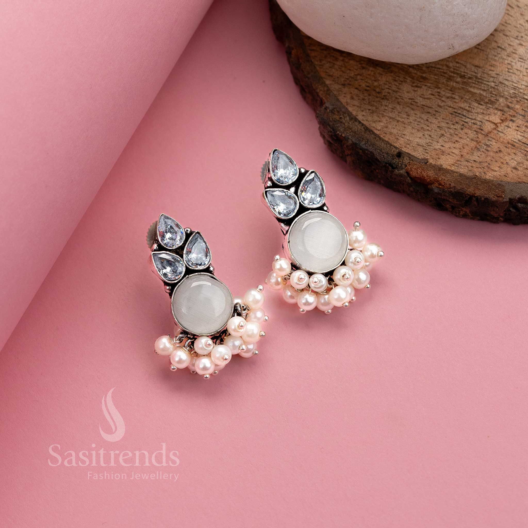 Royal white oxidised German silver earrings with Monalisa centrepiece, American diamonds and pearl drops – perfect festive jewellery from Sasitrends
