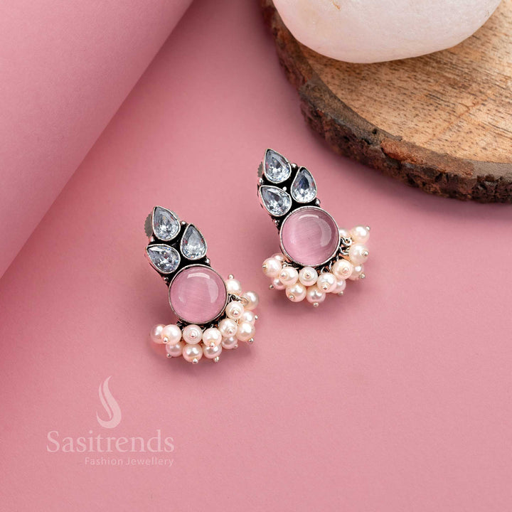Chic pink oxidised silver earrings with glowing Monalisa and AD accents, finished with pearl hangings – charming jewellery from Sasitrends